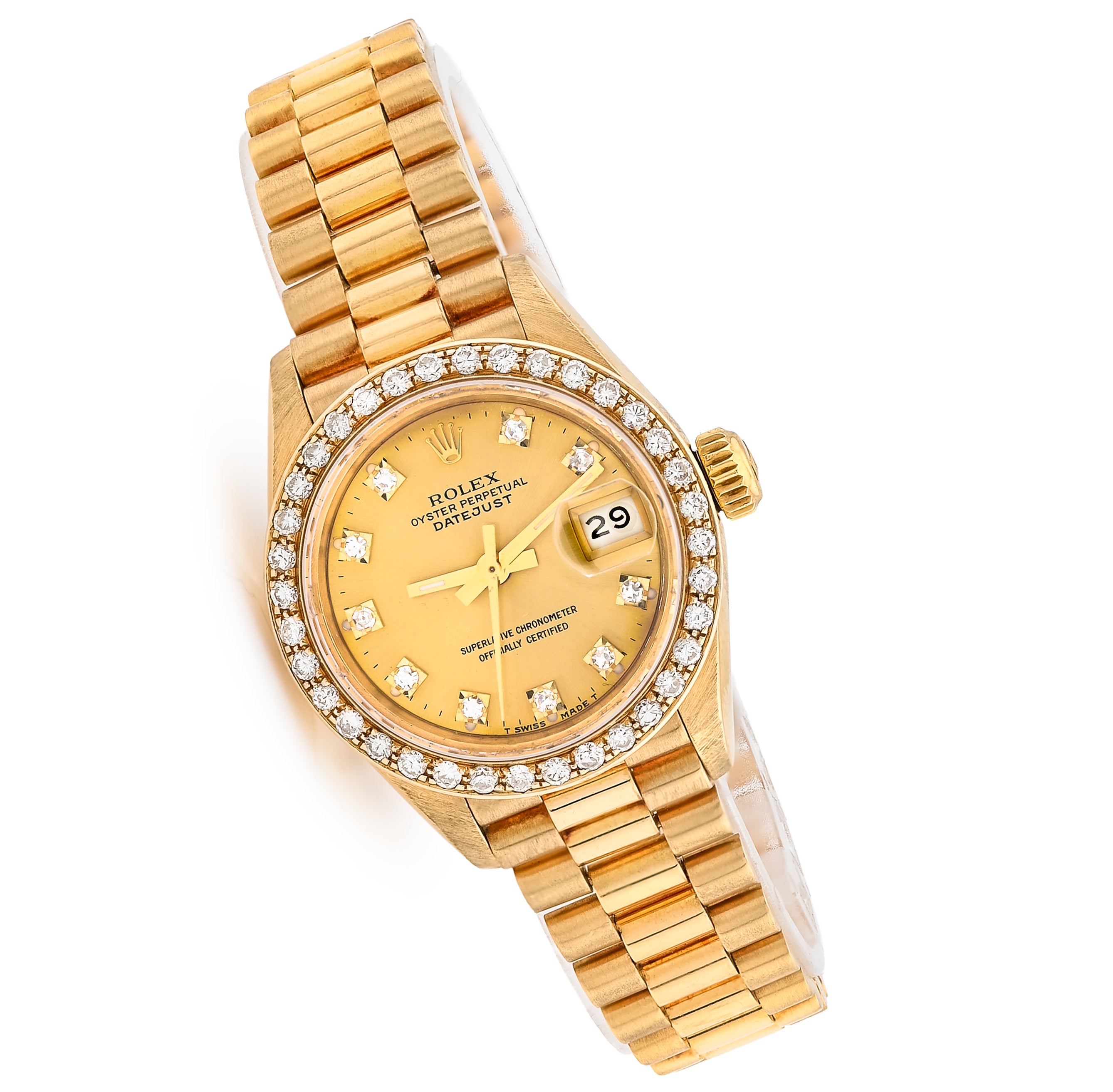 Gold Rolex watch with diamond-studded bezel on a white background