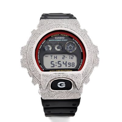 Casio digital watch with a heavily embellished silver case on a white background