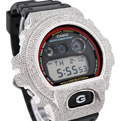 Casio digital watch with a heavily embellished silver case on a white background