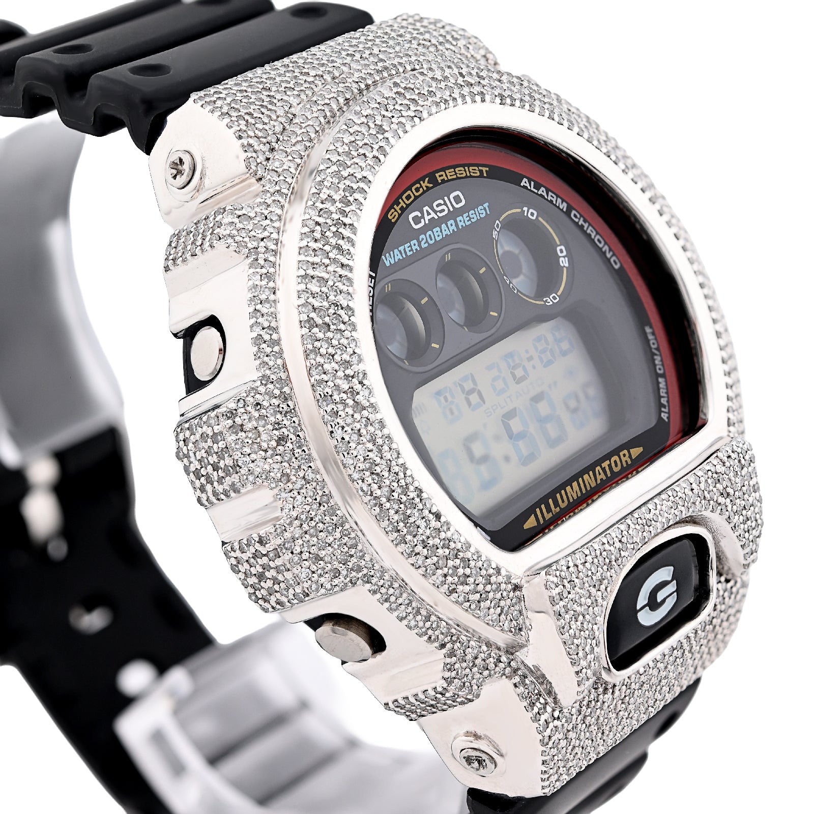 Digital watch with a heavily embellished silver case on a white background