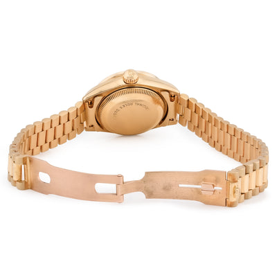 Gold bracelet with diamond accents on a white background